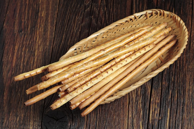 Salty breadsticks in wicker plate