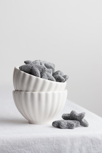 Salty liquorice salmiakki in Finnish in a white bowl