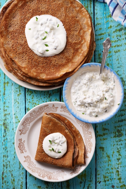 Salty pancakes with sour sauce