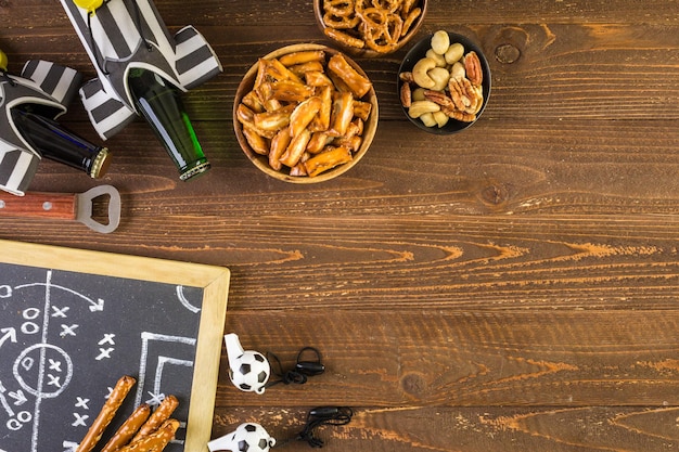 Salty snacks on the table to watch football game.