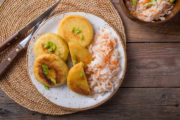 Salvadoran pupusa served with curtido