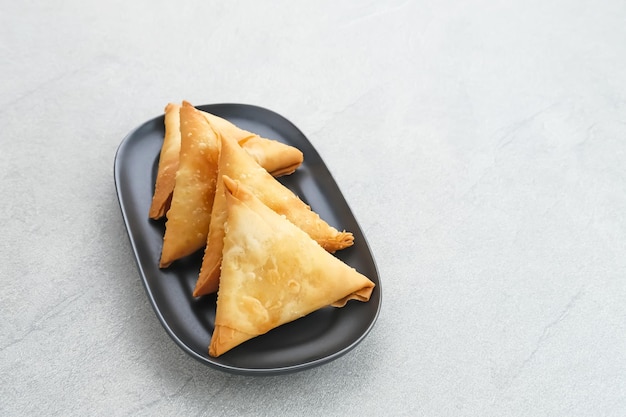 Samosa Keju a crispy triangle fried pastry snack with cheese filling