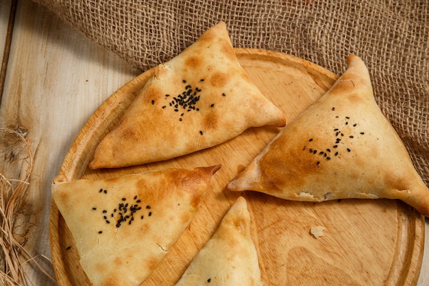 Samosa, samsa - meat stuffed pies, oriental style. Puff pastries with meat samosa 