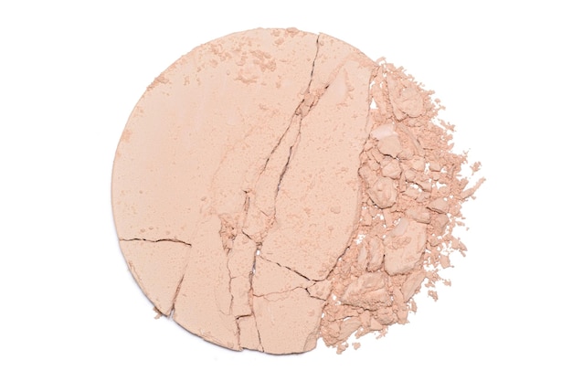 A sample of face powder in white Beige round cracked powder palette