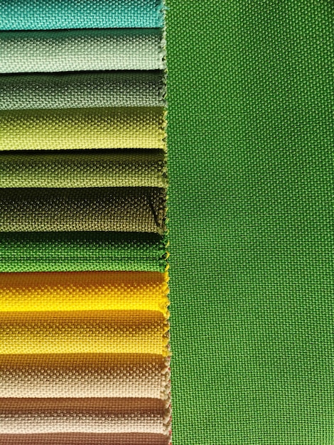 Samples of colorful fabric texture background. Green scale.