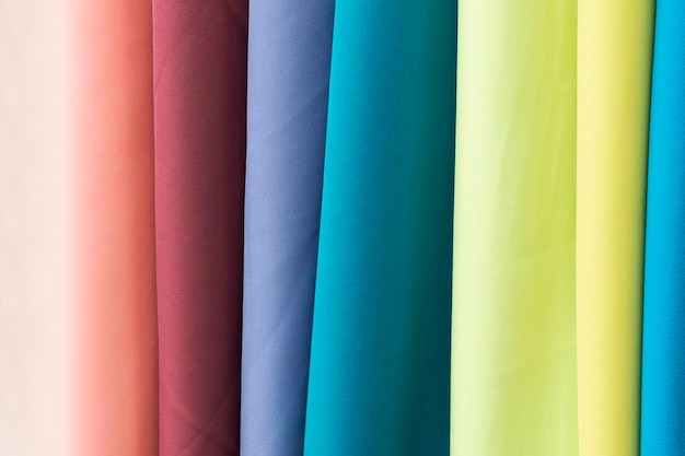 Samples of fabric - gabardine of different colors on the display case