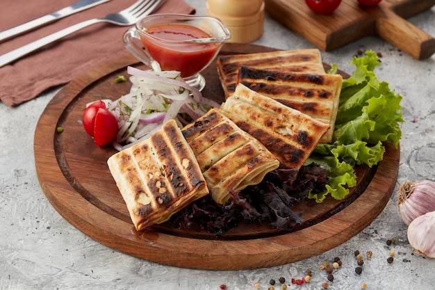 Samsa a bun with meat with lamb meat on a plate