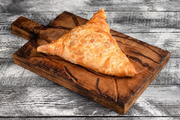 Samsa homemade samsa with chicken on a wooden white background