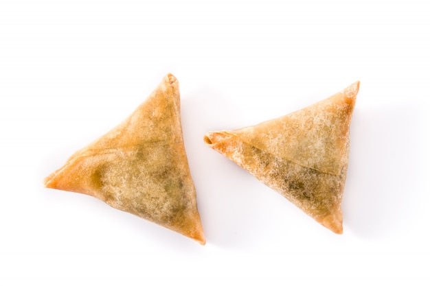 Samsa or samosas with meat and vegetables isolated on white. 