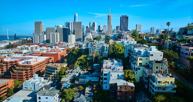 San Francisco residential apartments leading to downtown skyscrapers aerial of sunlight on buildings