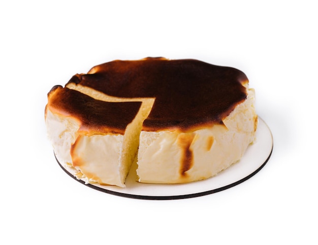 San sebastian cheesecake on plate isolated