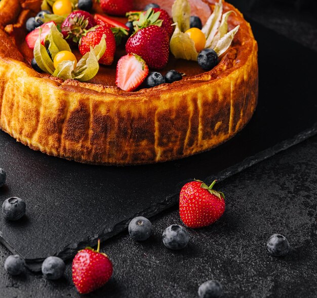 San Sebastian cheesecake with berries close up