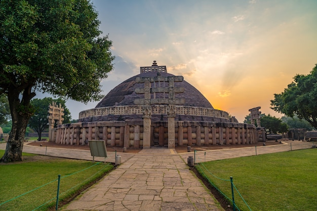 Sanchi Stupa, Madhya Pradesh, India. Ancient buddhist building, religion mystery, carved stone. Sunrise sky.