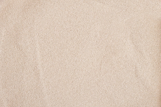 Sand background, texture of light sand top view copy space