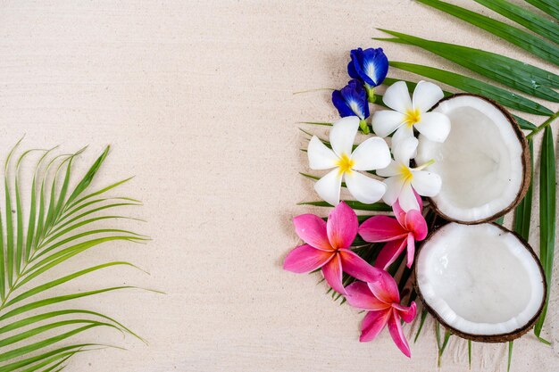 Sand Beach background with frangipani flowers.