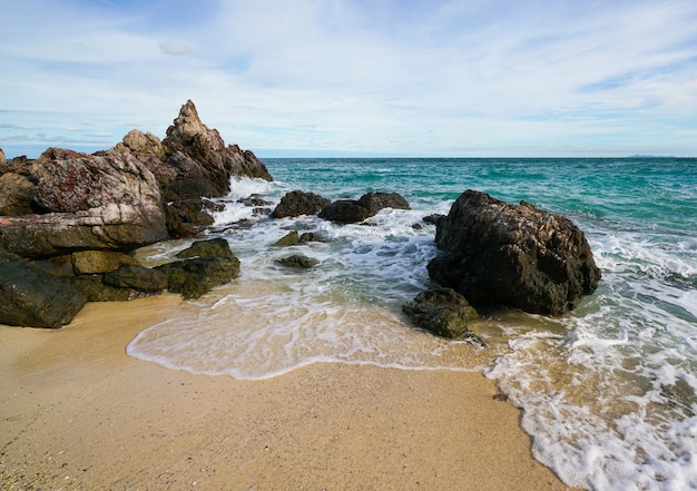 Sand beach among rocks at koh lan island thailand