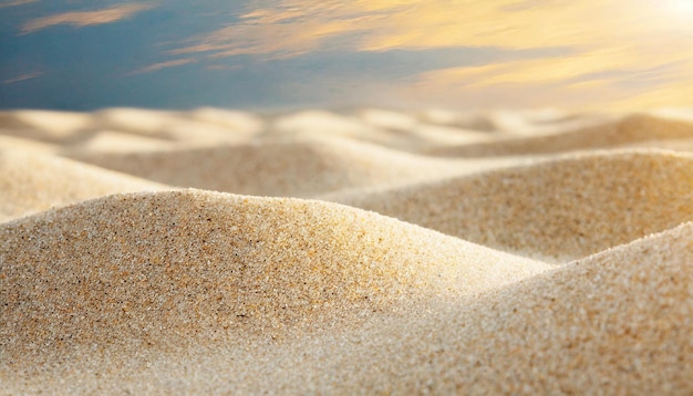 Photo sand dunes with the sun reflecting in the water