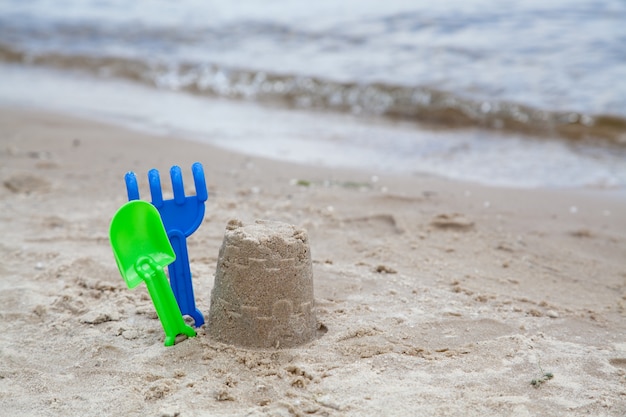 Sand toys on the beach near the water