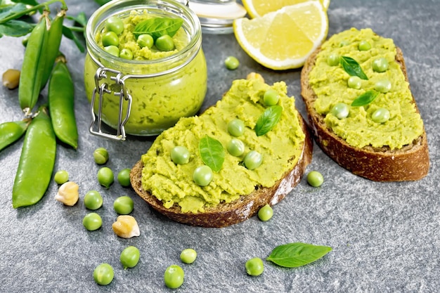 Sandwich green pea hummus on stone table