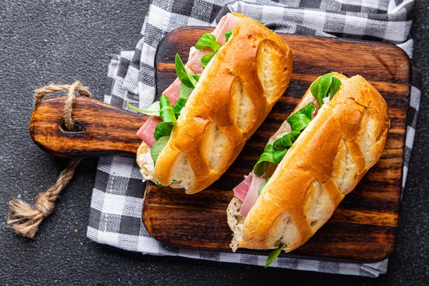 sandwich ham french milk buns, cheese, lettuce green leaves fresh meal food snack on the table copy