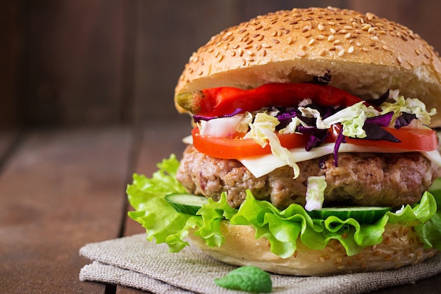 Sandwich hamburger with juicy burgers, cheese and mix of cabbage