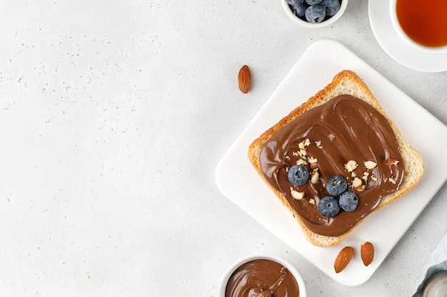 Sandwich toast with Chocolate cream and blueberry Toasted bread with sweet hazelnut chocolate sauce 