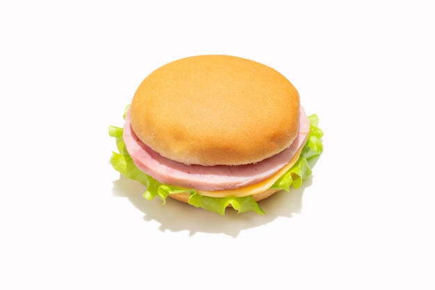 Sandwich with ham cheese lettuce on white background