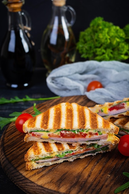 Sandwich with ham cheese mustard leaves tomatoes and onion Tasty club sandwiches