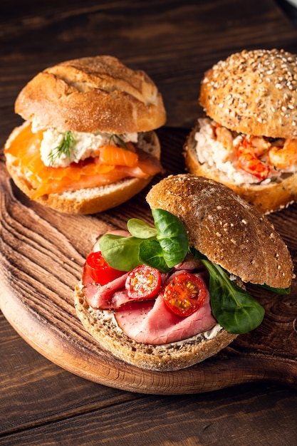 Sandwiche with beef, fresh tomatoes and lamb's lettuce, multigrain bun