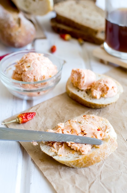 Sandwiches for breakfast with homemade spiced  butter with tomatoes, pepper and spices