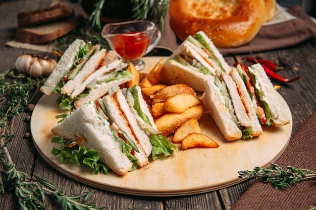 Sandwiches set with red sauce rustic potato wedges