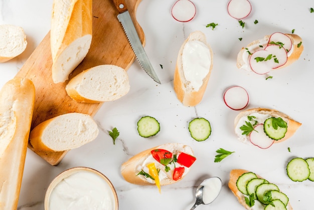 Sandwiches toast with homemade cream cheese and fresh vegetables