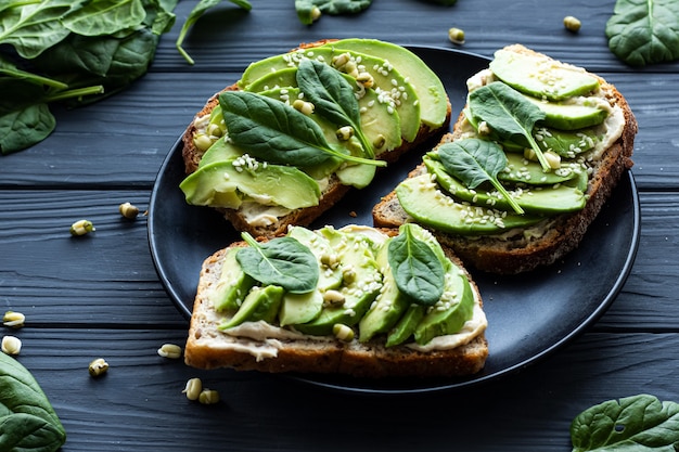 Sandwiches with avocado and spinach on a plate