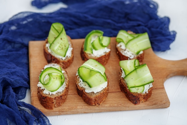 Sandwiches with cheese feta and cucumber. The concept of food an