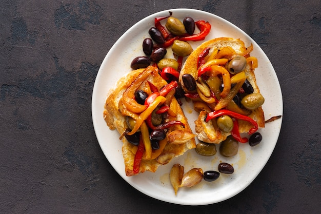 Sandwiches with grilled peppers, olives and garlic