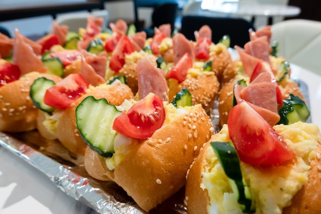 Sandwiches with pork and bread on the desk