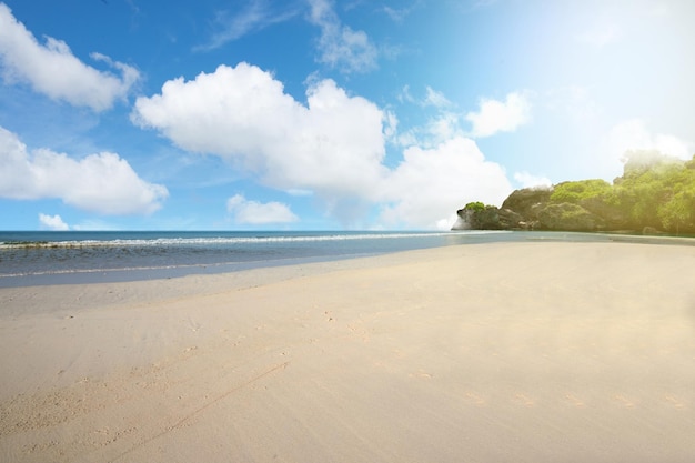 Sandy beach with the blue ocean