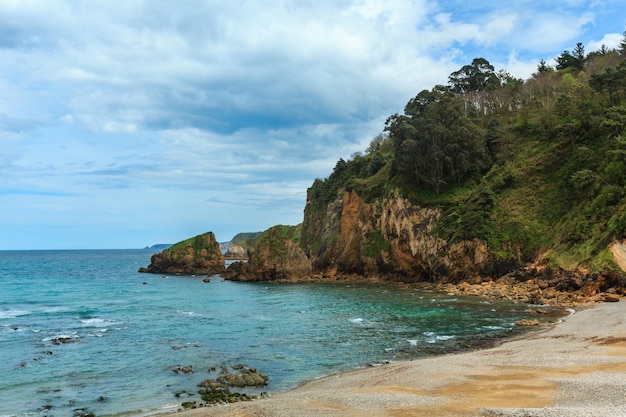 Sandy Cadavedo beach. Summer Atlantic ocean coast, Asturias, Spain.