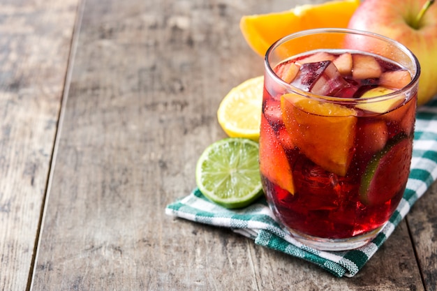 Sangria drink in glass on wooden table