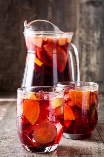 Sangria drink in glass on wooden table