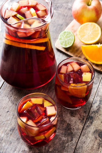 Sangria drink in glass on wooden table