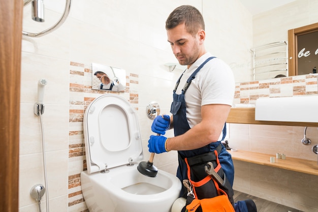 Sanitary technician using force cup