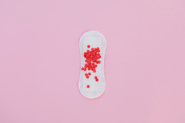 Sanitary towel with red sequins