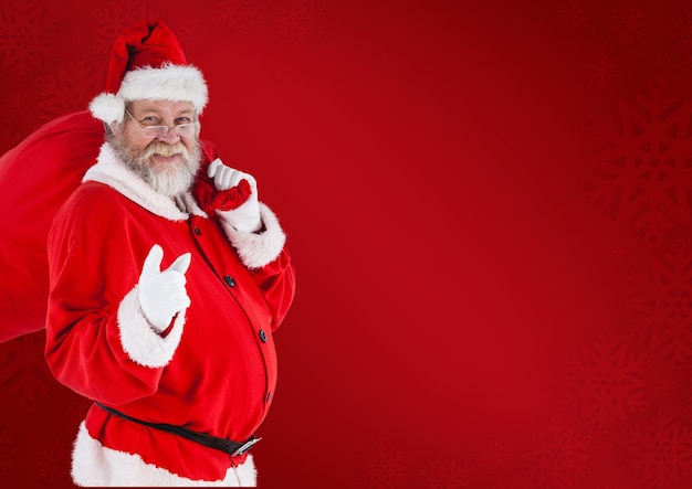 Santa claus carrying gift bag