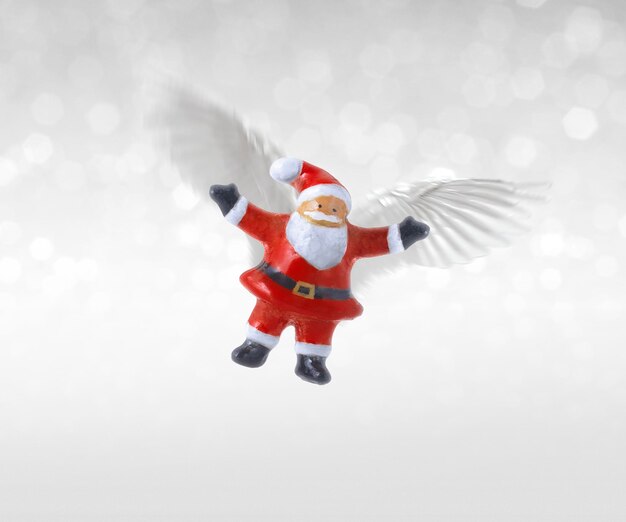 Photo santa claus ceramic doll with wings flying