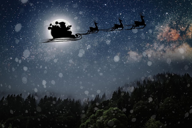 Santa Claus flies on Christmas Eve in the night sky with snow