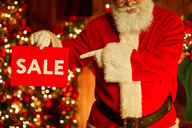 Santa Claus Holding Sale Sign Close Up