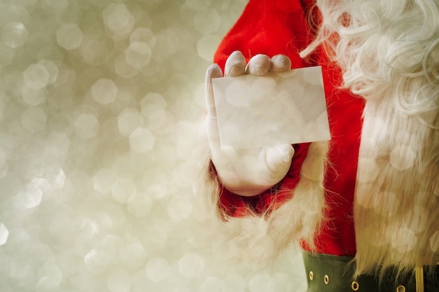 Santa Claus holding visit card