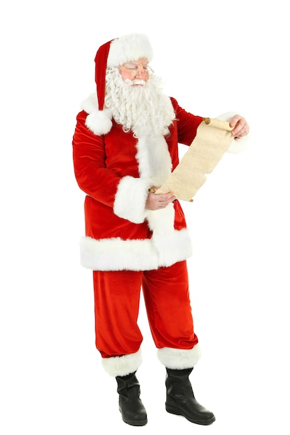 Santa Claus holding wish list, isolated on white background