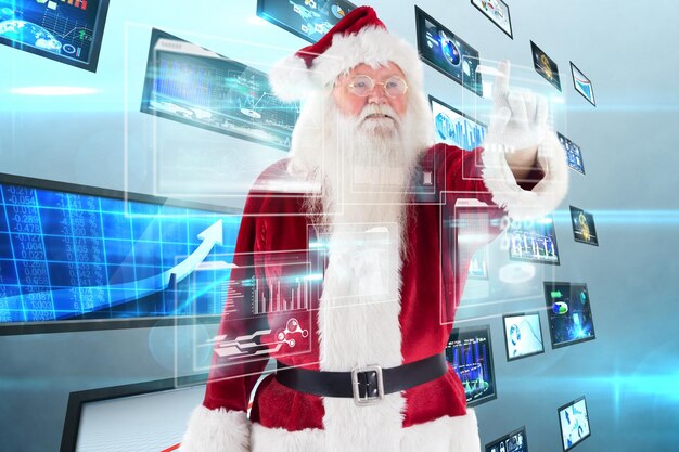 Photo santa claus points at something against screen collage showing business images